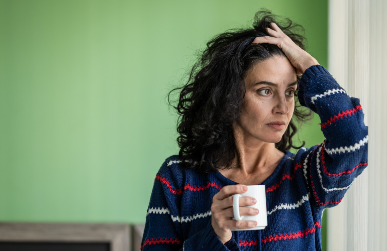 3 Women's Diabetes Health Issues. Women thinking with a coffee cup.