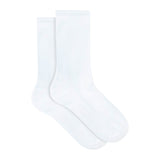Underworks women's white cotton-rich, crew length socks shown out of packaging. 