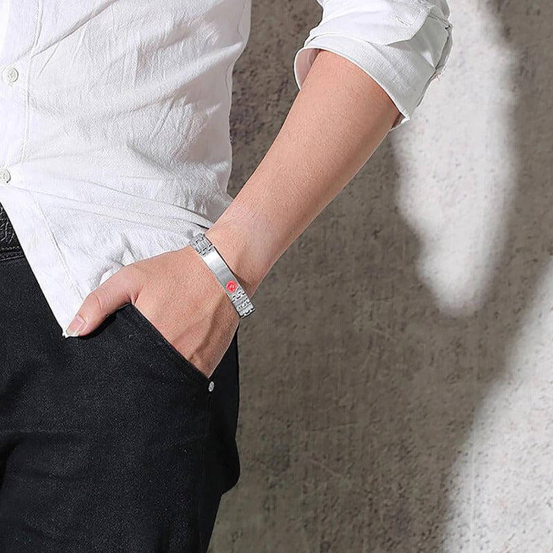 Brushed silver coloured stainless steel medical alert: linked bracelet modelled on wrist. It has red medi-alert symbol and comes engraved with 'Type 1 Diabetes', 'Type 2 Diabetes' or 'Insulin Dependent'.