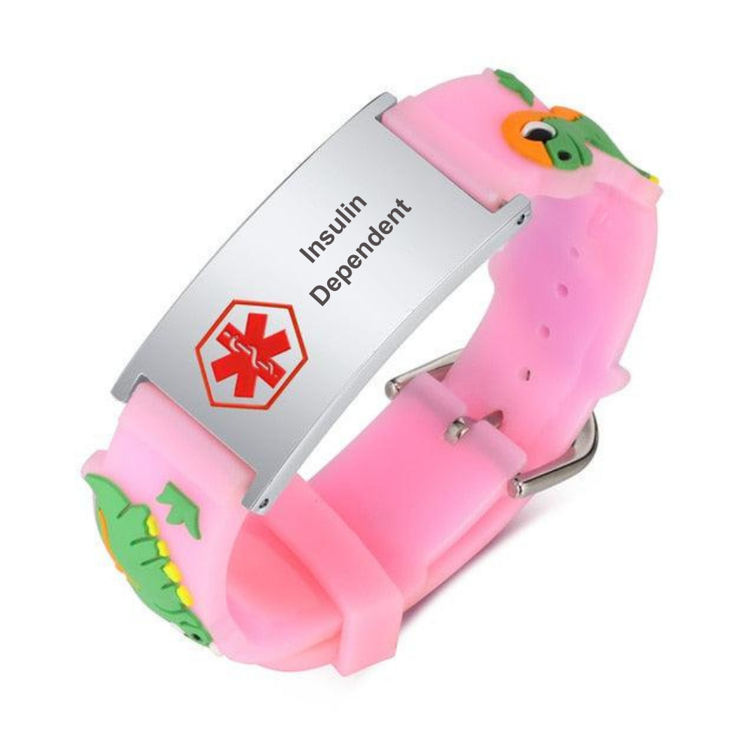 Insulin Dependent medical alert bracelet for a child. Bracelet band is made of pink silicone with a dinosaur design. The alert plate is stainless steel with red medi-alert symbol and 'Insulin Dependent' engraved on the plate.