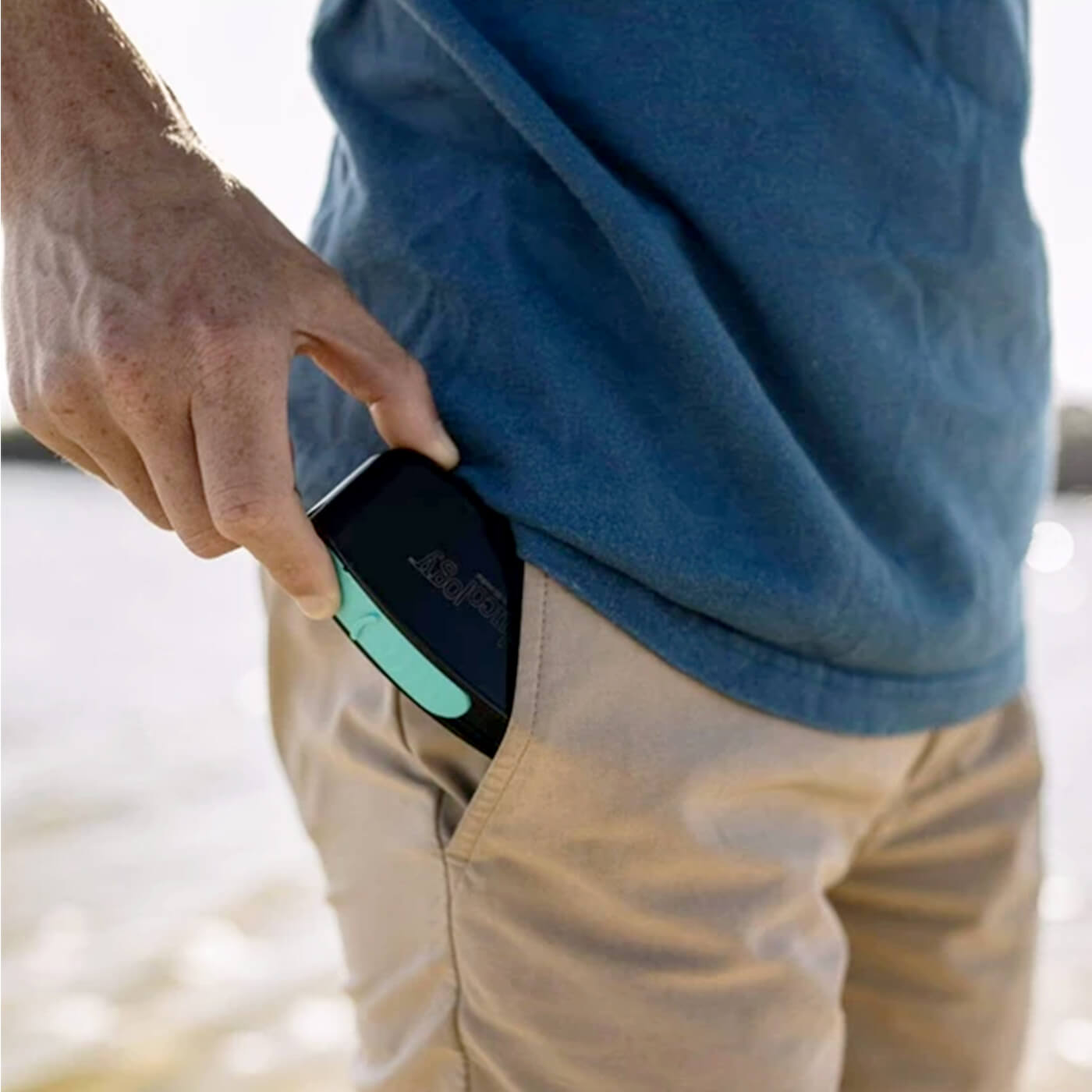 Man Putting Glucology Pen Needle Pocket Container in pants pocket.