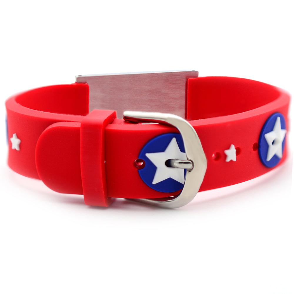 'Back view of medical alert bracelet for a child. Bracelet band is made of red silicone with a star design and has a watch-style clasp. Also shows the back of the stainless steel alert plate.